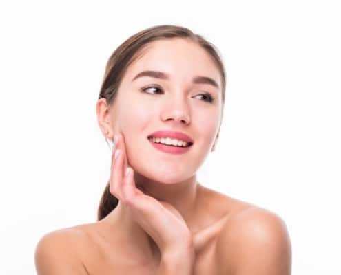 beautiful-spa-young-woman-touching-her-face-isolated-white-wall_231208-1373