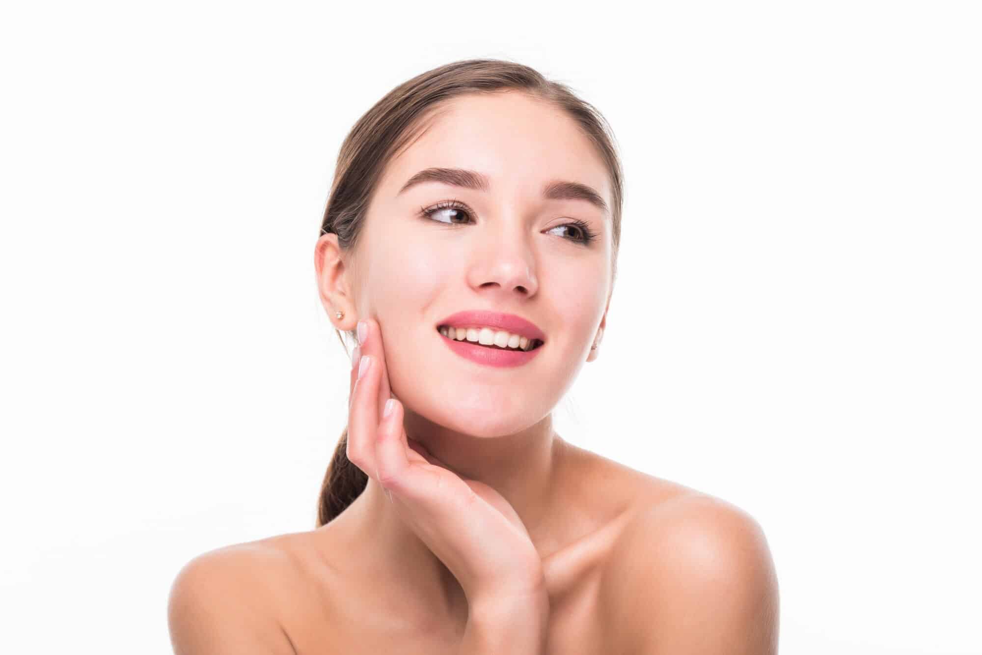 beautiful-spa-young-woman-touching-her-face-isolated-white-wall_231208-1373